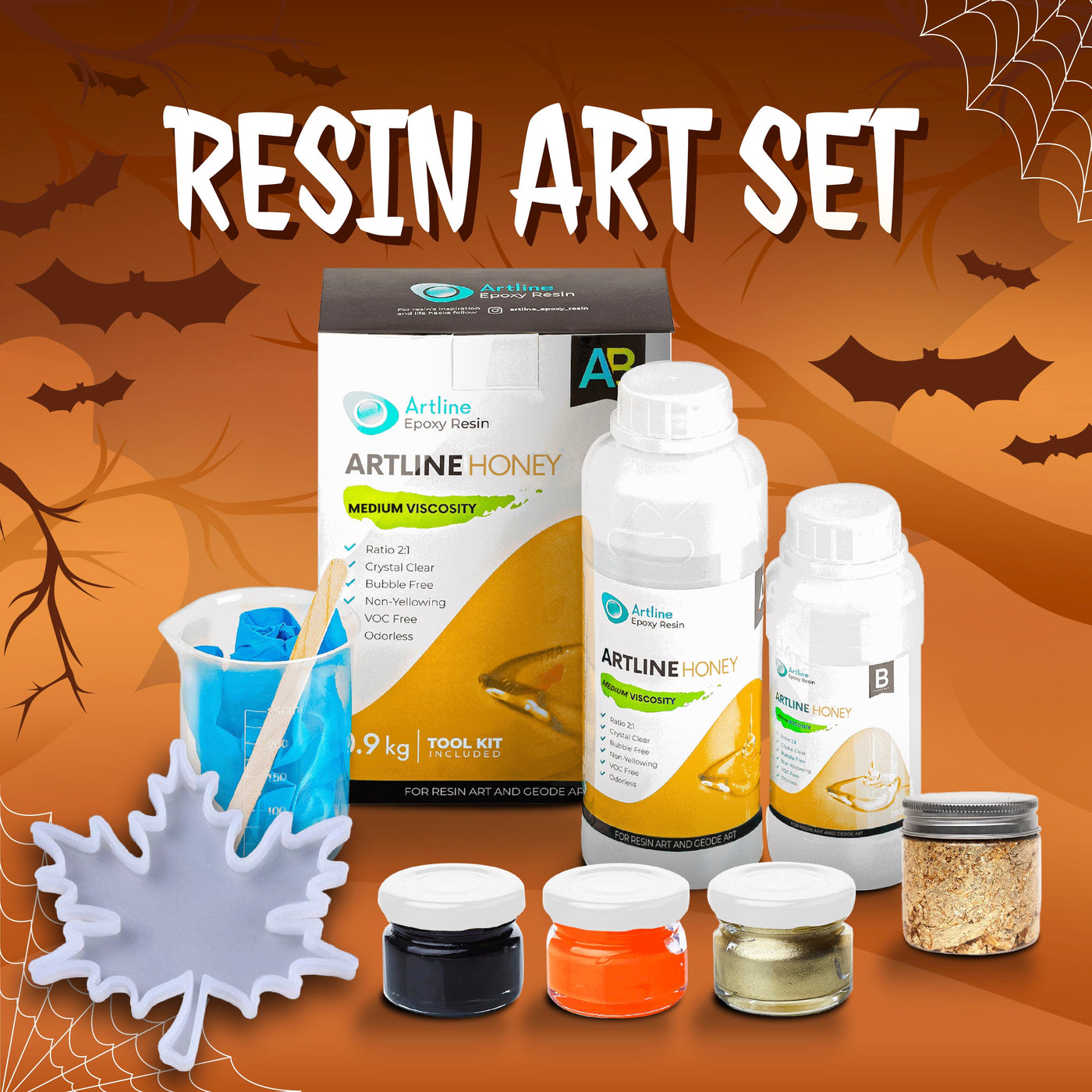 Artline Halloween Resin Craft Kit with epoxy resin, gold, black, and orange pigments, mixing tools, and silicone mold for Halloween decorations