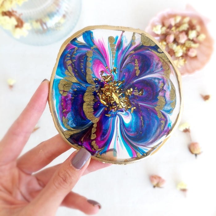 Pigment Paste Pale Purple artwork in hand, showcasing vivid and gold-accented epoxy resin design.