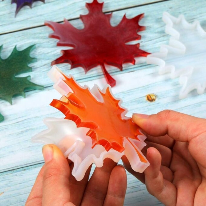 Silicone mold in maple leaf shape for crafting and resin art.