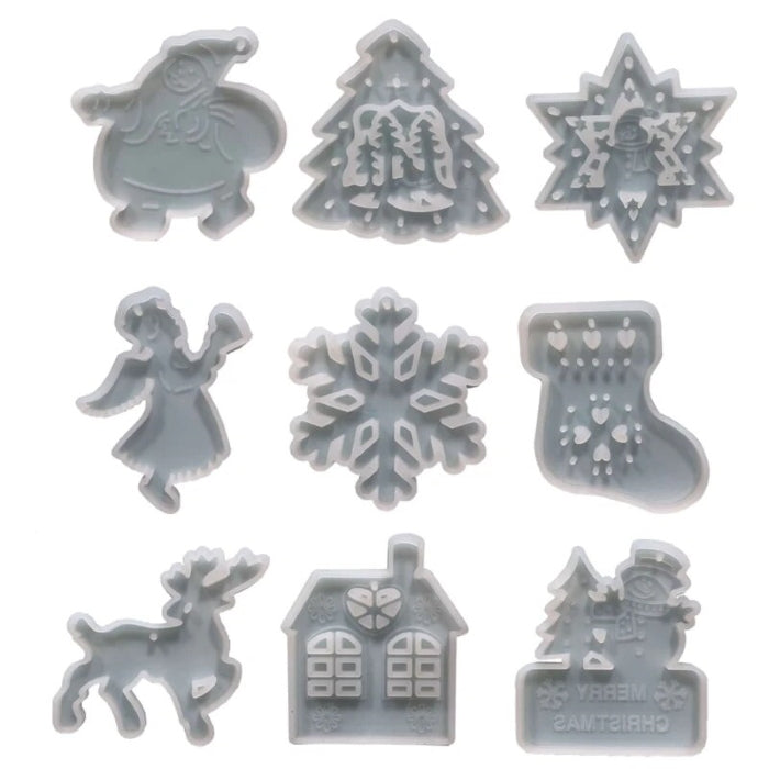 Set of 9 translucent silicone molds with Christmas ornament shapes including Santa, tree, star, angel, snowflake, stocking, reindeer, house, and snowman designs for resin crafts