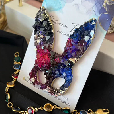 Colorful epoxy resin rabbit-shaped accessory showcasing crystal-like texture on display card.