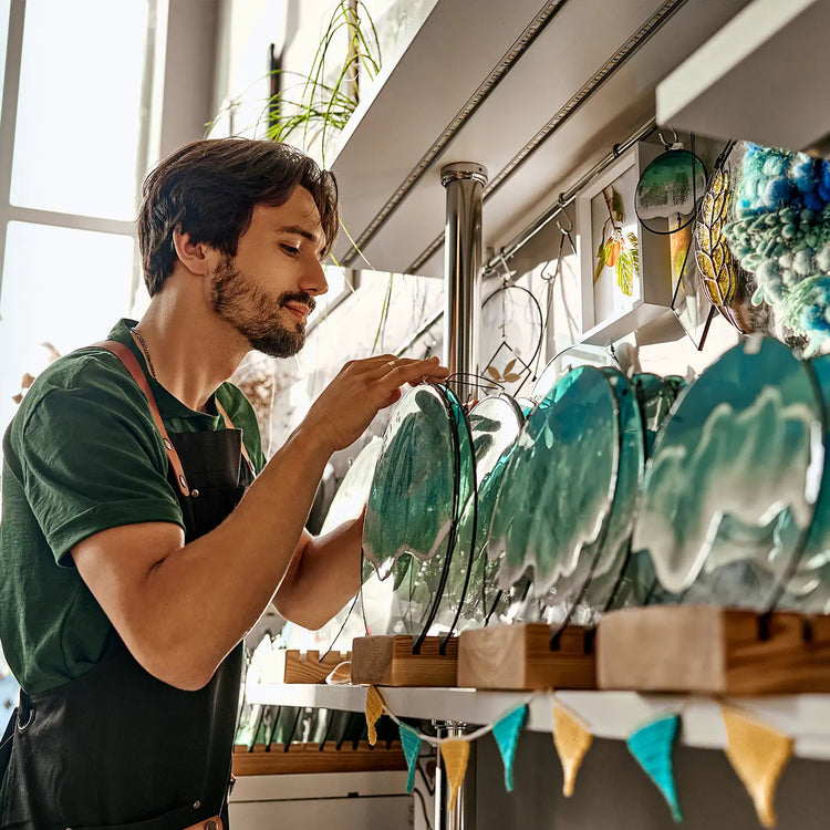 Male epoxy resin artist in his art studio