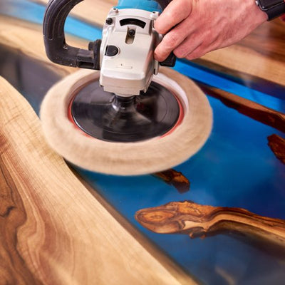 Polishing wood surface with Wood PRO Epoxy Resin, ensures a smooth, crystal-clear finish.